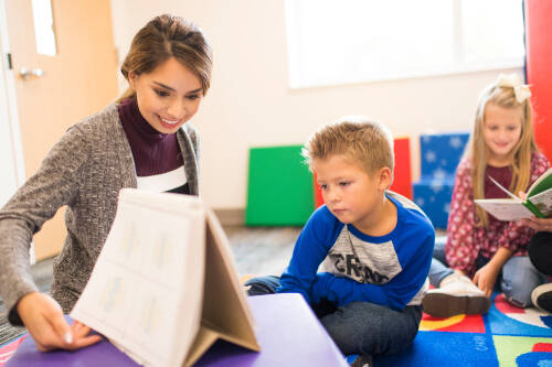 Student practices lesson with young child